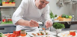Chef preparing appetizers on river cruise